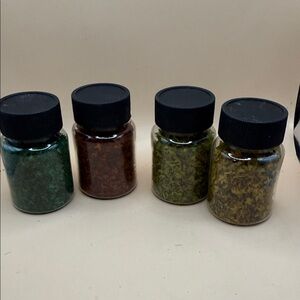 Set of Four Craft jars of leaves